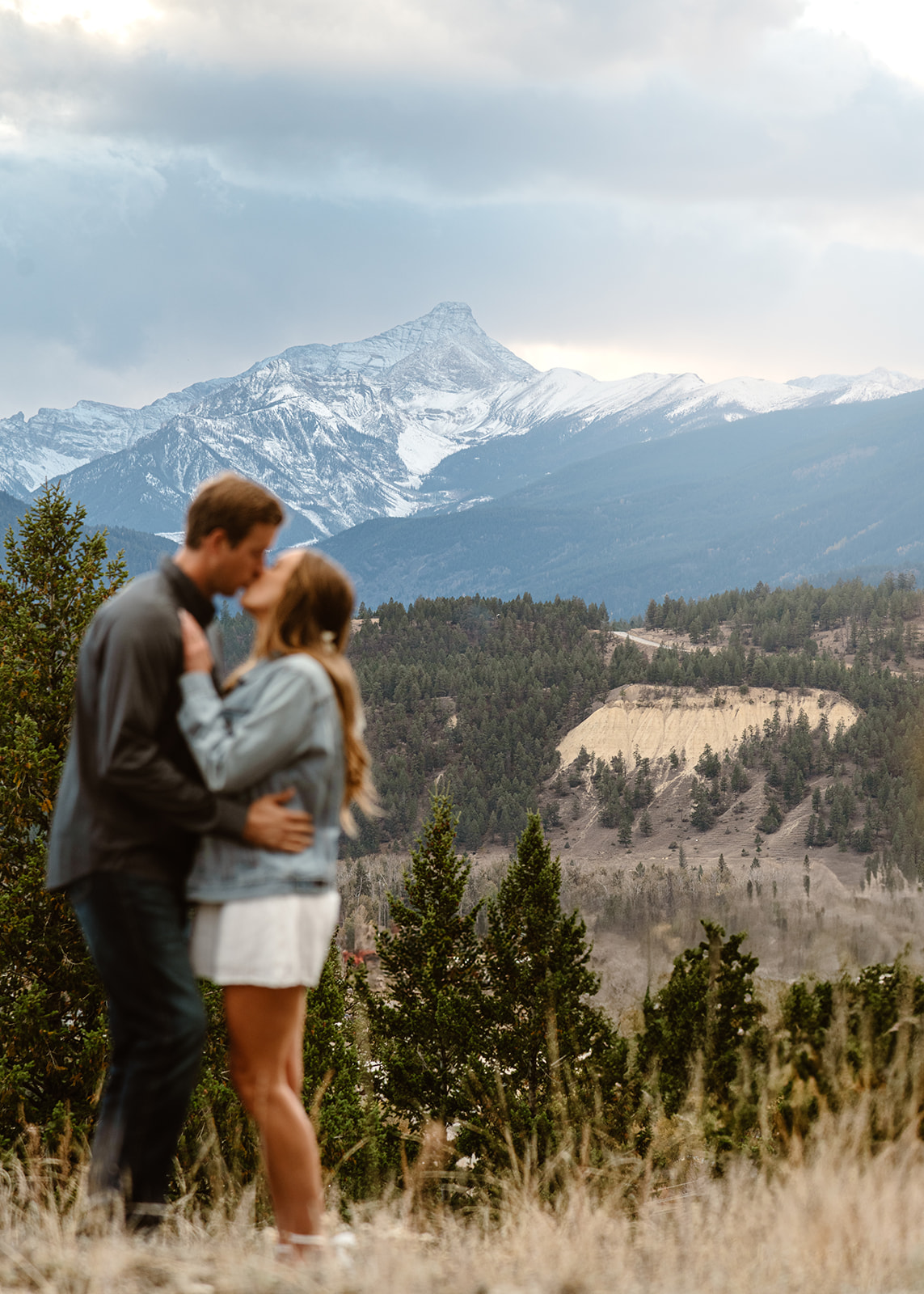 Jessica & Wyatt Engagement Session a couple at sunset in Invermere BC captured by Estelle Gonord Photography