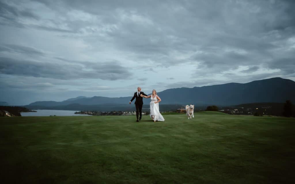 bride and groom running at twilight, invermere BC